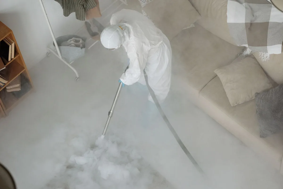 Biohazard cleanup technician in protective equipment, Washington, GA